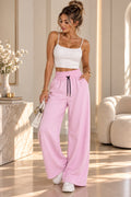 Pantalon large rose poudré femme à taille smockée – vue de face